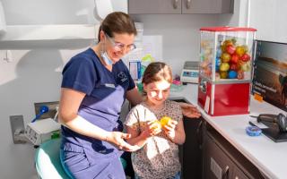 Image of a dentist managing a patient with dental anxiety.